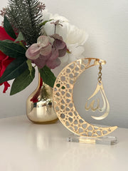 Golden acrylic crescent moon display stand featuring the word 'Allah' in elegant calligraphy.