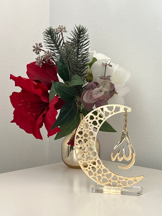 Golden acrylic crescent moon display stand featuring the word 'Allah' in elegant calligraphy.