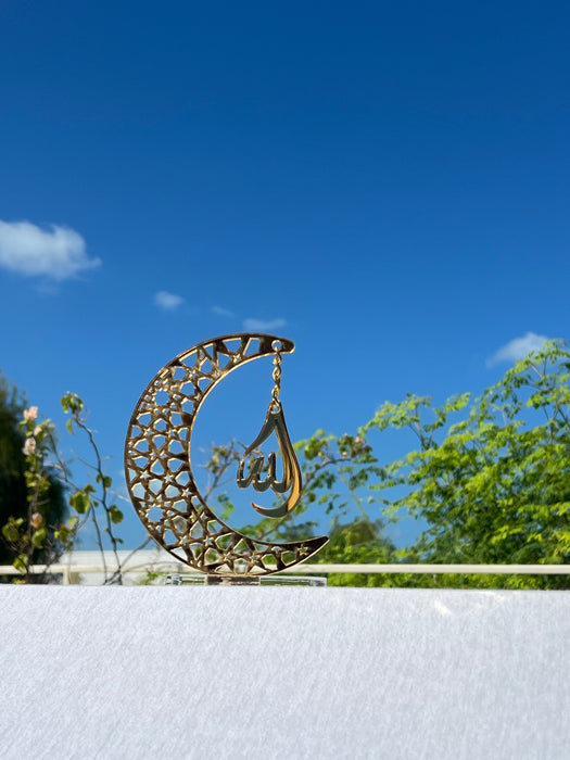 Golden acrylic crescent moon display stand featuring the word 'Allah' in elegant calligraphy.