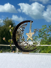 Golden acrylic 'Ramadan Kareem' crescent moon and star decorative stand for home decor or Ramadan gift.