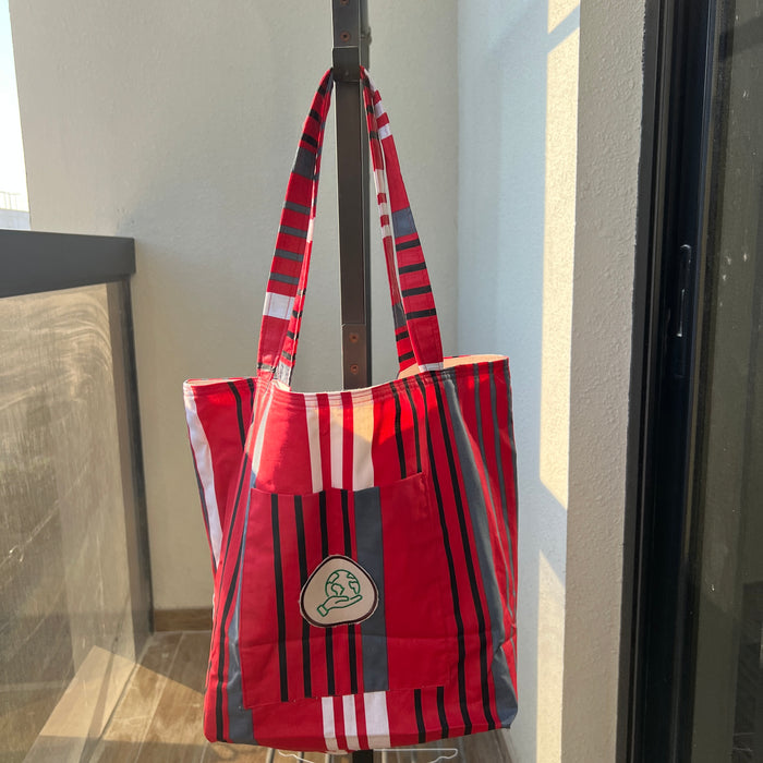 Red, Black stripes Grocery Bag with Earth in hand Applique