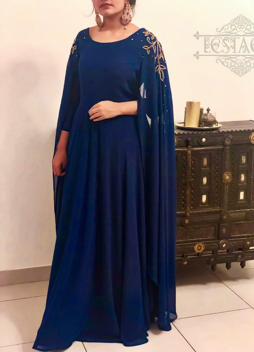 blue cape sleeved gown