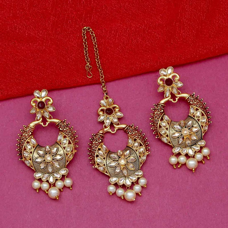 maroon earrings and maang tikka