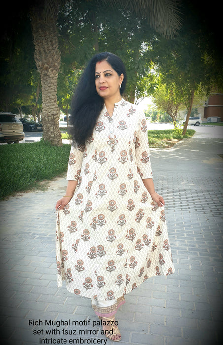 Off white A line kurta without slits with mughal motifs and similar broad pants for elegant looks