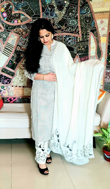 Daisy white kurta in black stripes with mul cotton dupatta and pants with bird print details